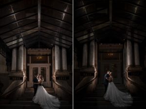 A bride and groom standing on the steps of a building in New York.