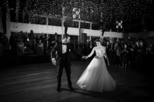 A black and white photo capturing the bride and groom's first dance at their elegant New York wedding.