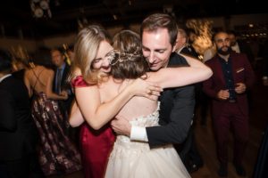 A bride and groom hugging on the dance floor at their New York wedding.