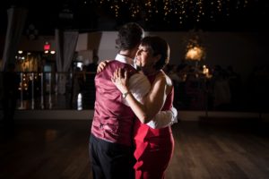 A newlywed couple sharing their first dance at their elegant wedding in New York.