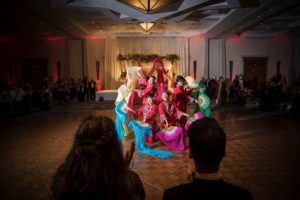 A group of dancers performing at a wedding reception in New York.