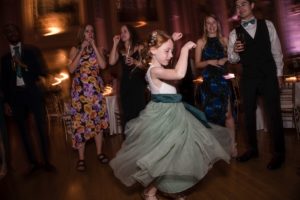 A little girl dancing at a wedding in New York.