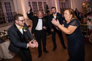 A group of people dancing at a New York wedding reception.