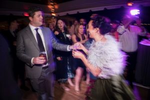 A man and woman gracefully dancing at a wedding reception in New York.