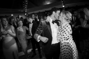 A bride and groom kissing on the dance floor at their New York wedding.