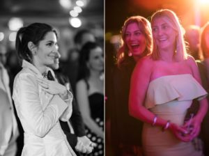 Two women laughing at a wedding event in New York.