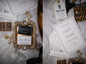 A gold and black wedding stationery set on a table in New York.