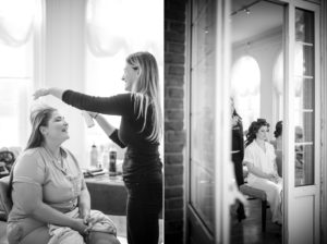 A New York bride getting ready in front of a mirror for her wedding.
