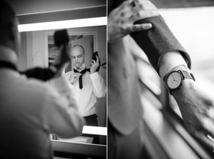 A man in New York is adjusting his watch in front of a mirror before a wedding.
