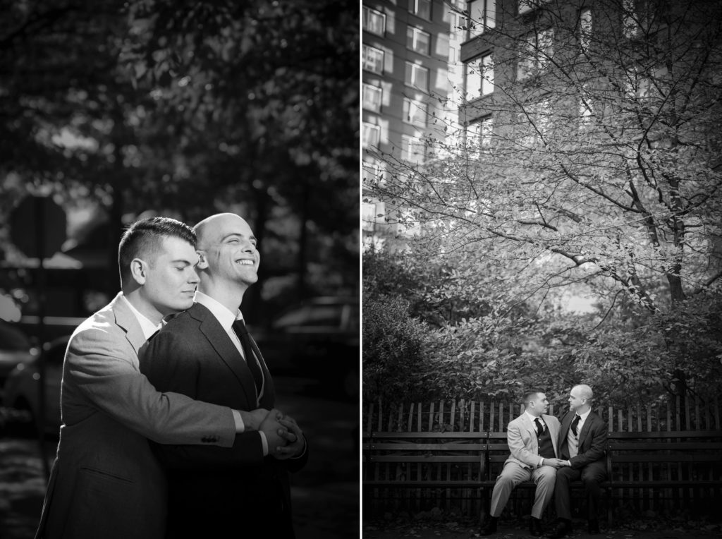 Two men hugging on a bench in front of a wedding building.