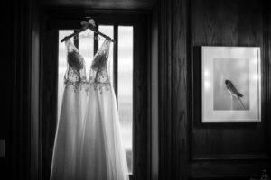 A wedding dress hanging in a New York window.