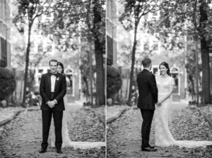 A newlywed couple standing on a cobblestone street in New York after their wedding.