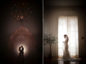 A wedding couple standing in front of a chandelier in New York.