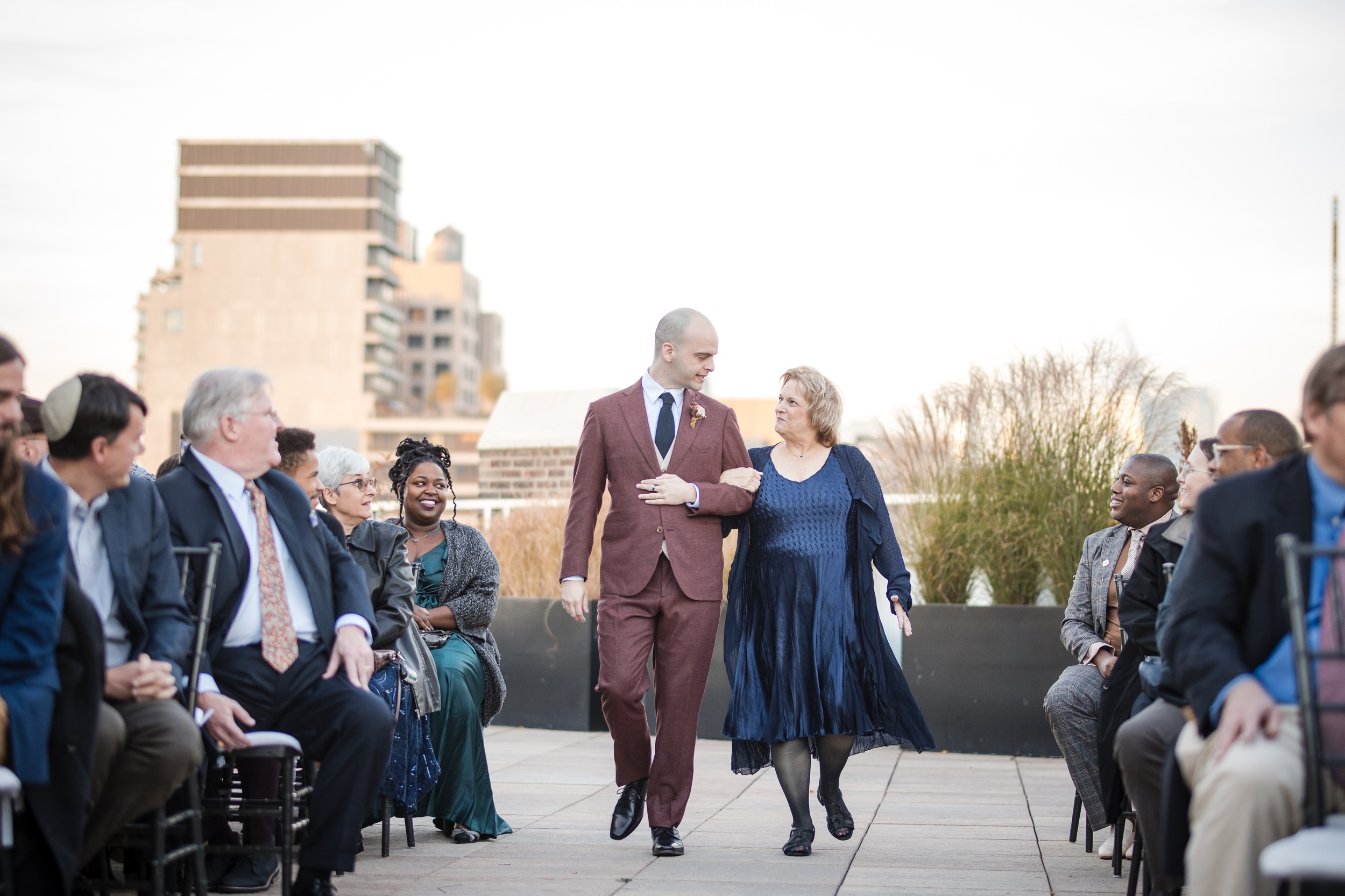 Groom walks down the aisle with his mother at a Tribeca Rooftop wedding