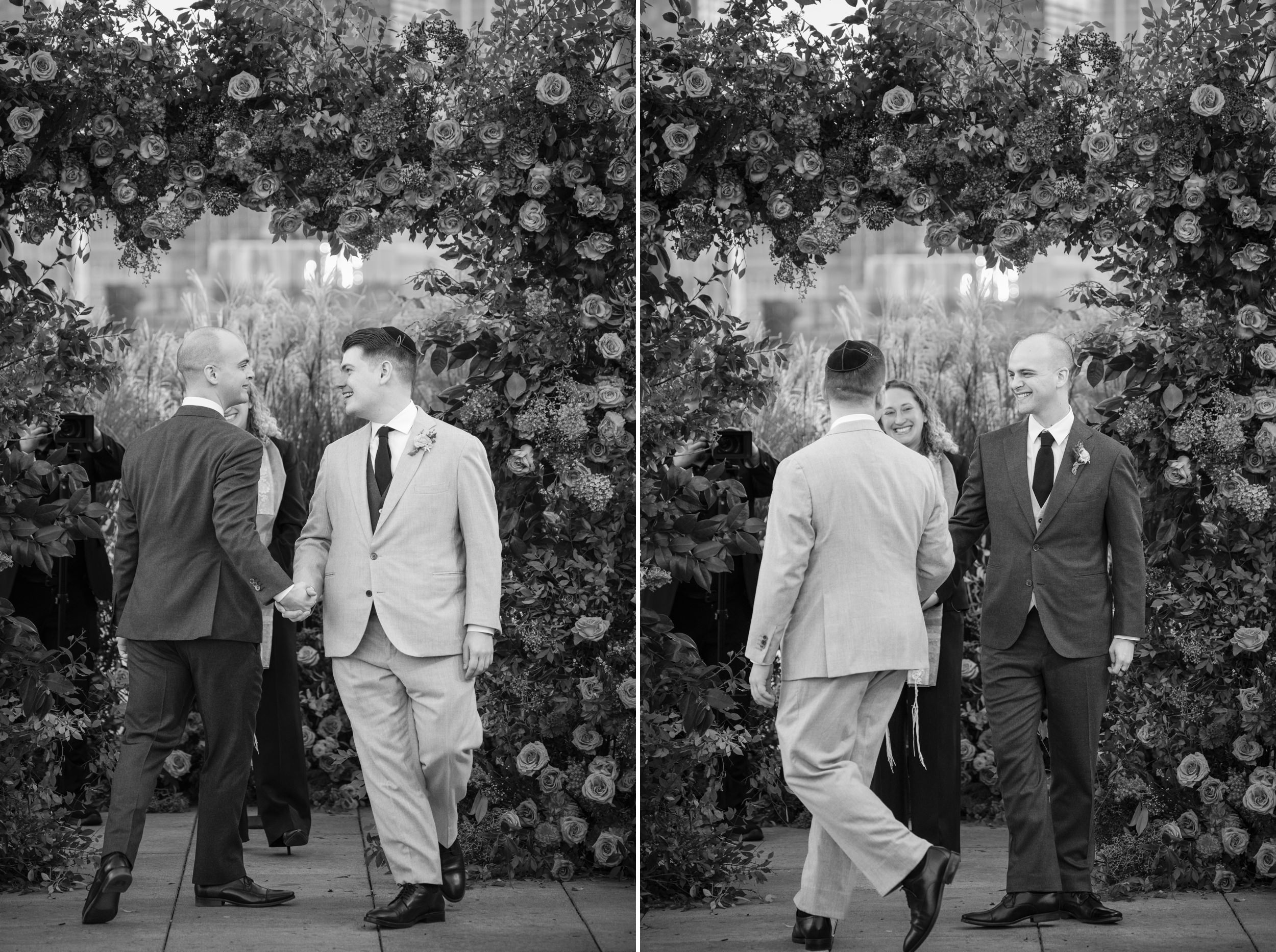 Grooms circle each other in front of a flower arch at a Tribeca Rooftop wedding