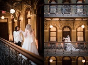 A bride and groom standing on the balcony of a historic building in New York, capturing the essence of their beautiful wedding day.
