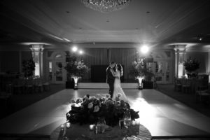 A bride and groom beautifully dance in a New York ballroom at their elegant wedding.