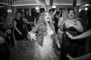 A bride is dancing on the dance floor at a wedding in New York.