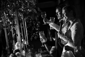 A bride and groom toasting at their New York wedding reception.
