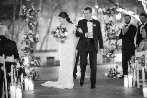 A bride and groom walking down the aisle at a New York wedding.