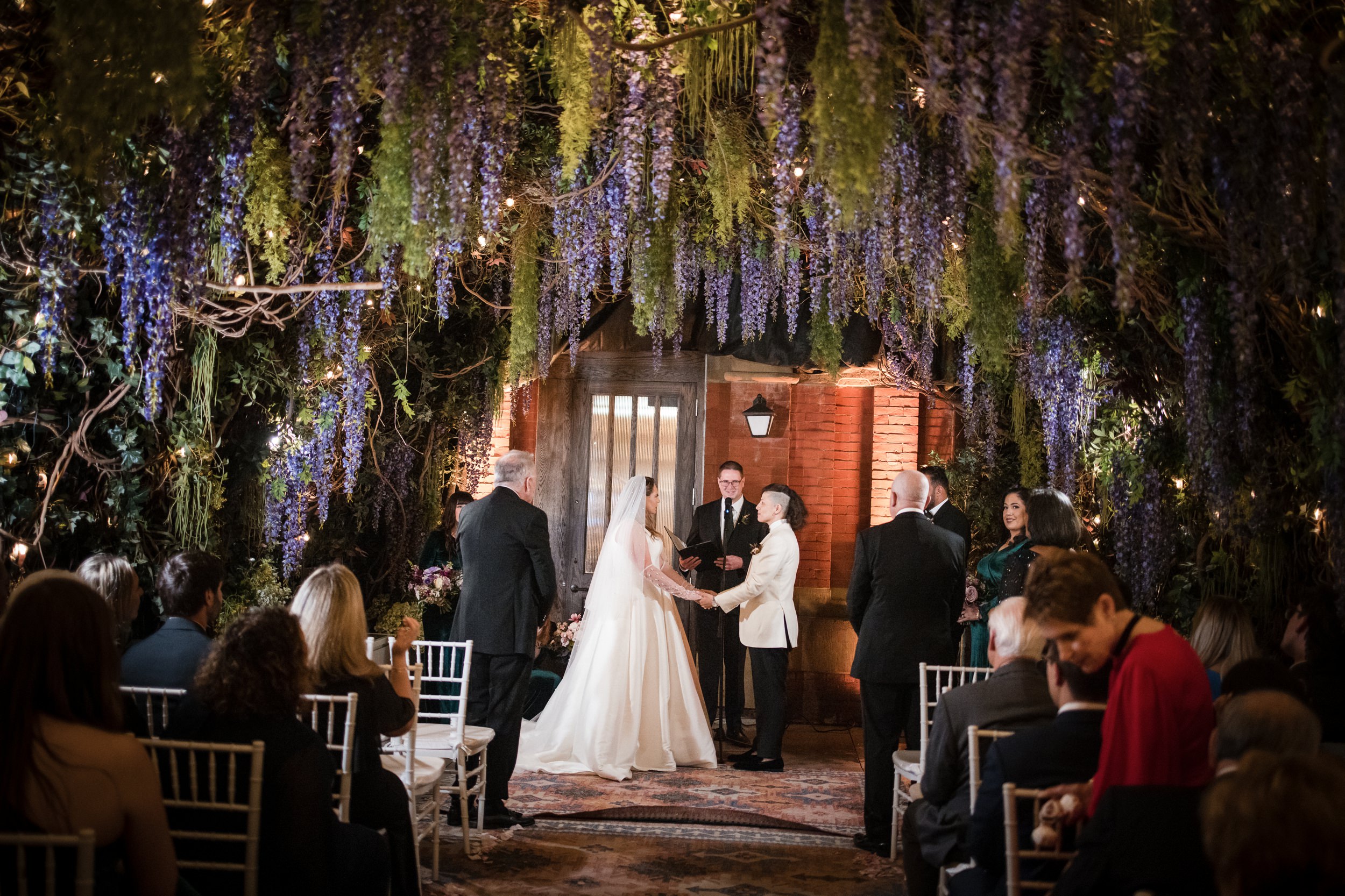Wedding ceremony in the wisteria garden at a Beekman Hotel wedding in NYC