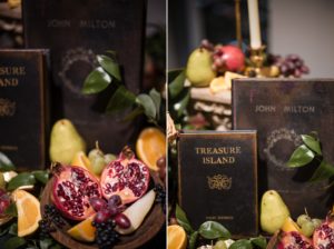 A wedding table in New York adorned with a variety of fresh fruit and an elegant book.