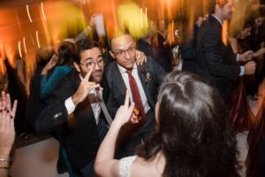 A group of people dancing at a New York wedding reception.