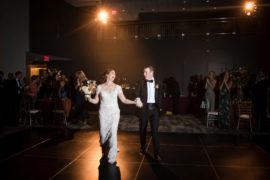 A bride and groom elegantly gliding across the dance floor at their wedding reception in New York.