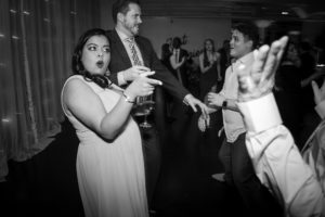 A newlywed couple dancing at their elegant wedding reception in New York City.