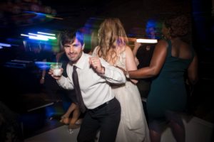 A bride and groom from New York dancing on the dance floor at their wedding.