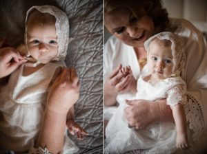 A woman is holding a baby in a white dress at a wedding in New York.