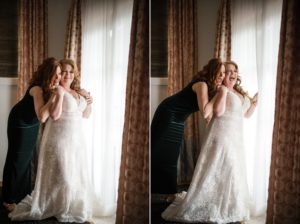 A bride is getting ready in front of a window in New York for her wedding.