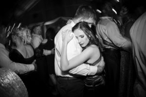 A couple hugging on the dance floor at a New York wedding.