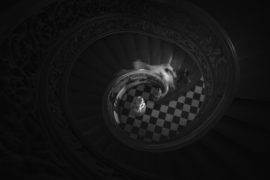 A black and white image of a spiral staircase in New York.