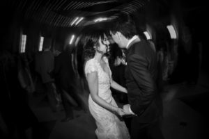 A black and white photo of a wedding couple dancing in New York.