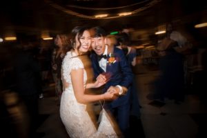 A bride and groom dancing at a wedding reception in New York.