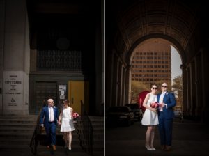 A beautiful wedding picture of a couple standing in front of a building in New York.