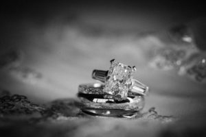 A black and white photograph of a wedding ring in New York.