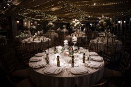 A wedding reception in New York set up with tables and chairs.
