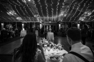 A black and white photo of a bride and groom at a New York wedding reception.