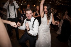 A bride and groom dancing at their wedding reception in New York.