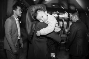 A black and white photo of a woman holding a baby in New York.