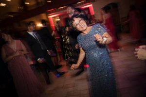 A woman dancing at a wedding reception in New York.