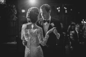 A wedding photo of a bride and groom sharing their first dance at the Bowery Hotel.