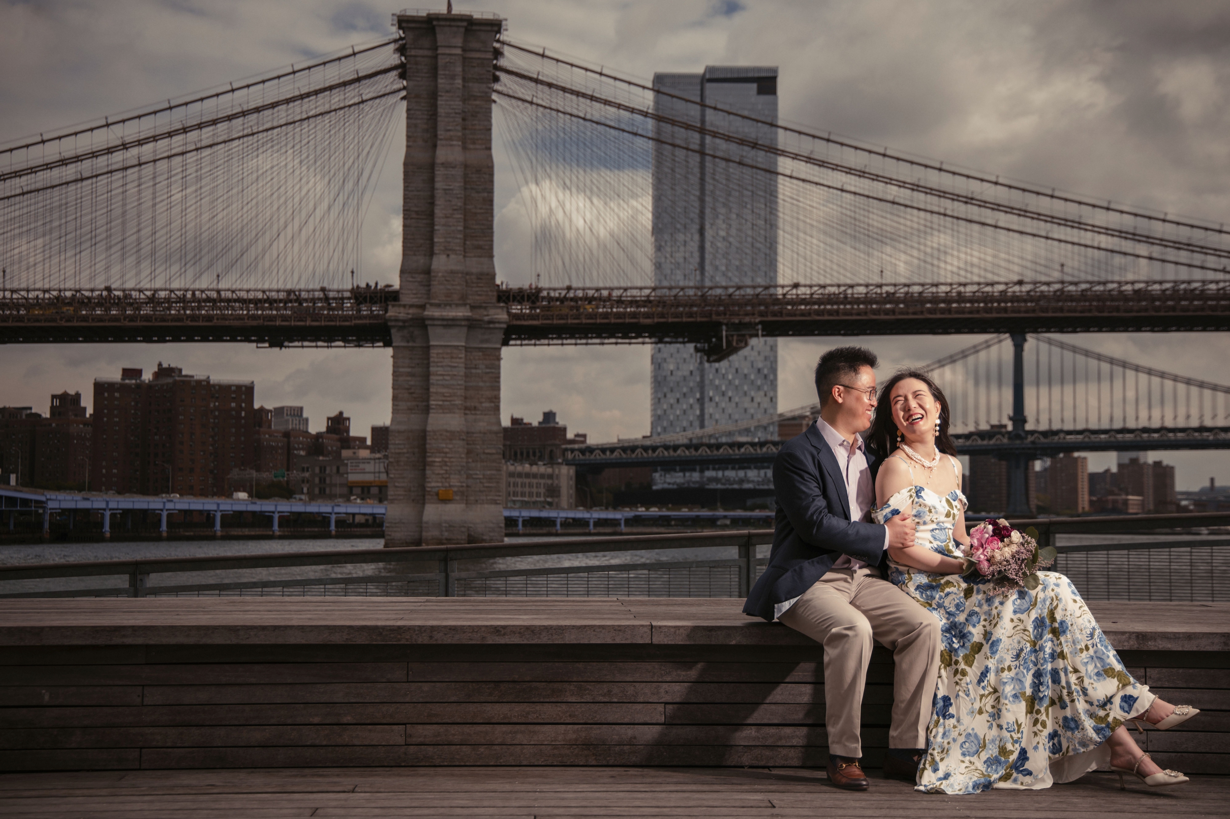 wedding couple laughing at the south street seaport on their wedding day