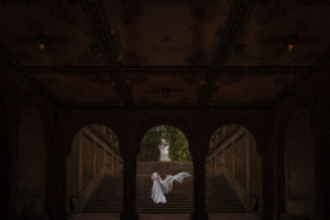 bride with a veil on the steps of bethesda terrace in central park