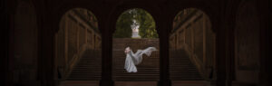 bride with a veil on the steps of bethesda terrace in central park