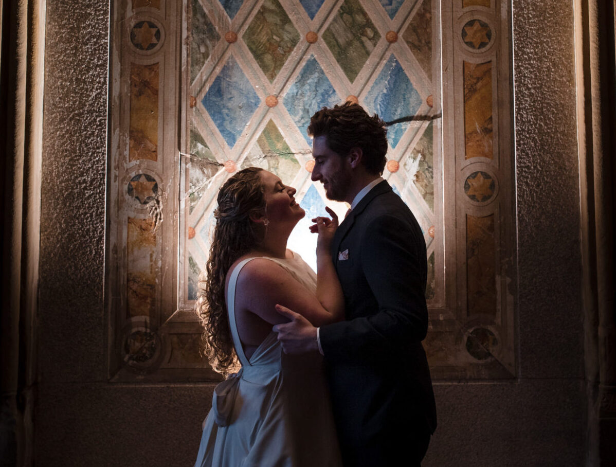 couple against the walls of bethesda terrace wedding photo