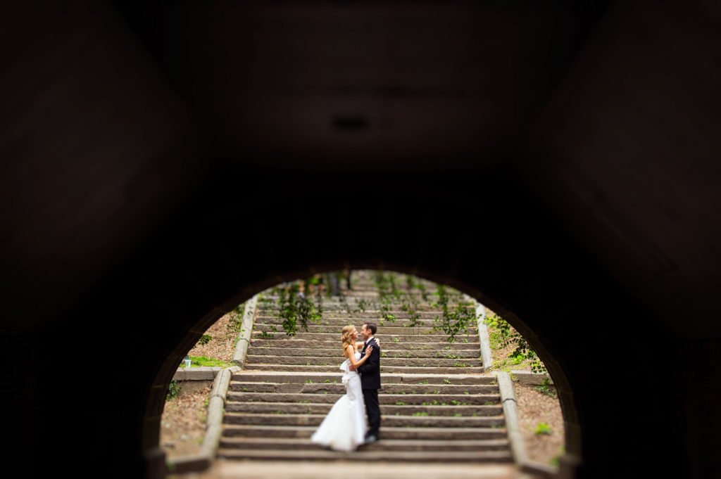 couple under a bridge central park wedding photography