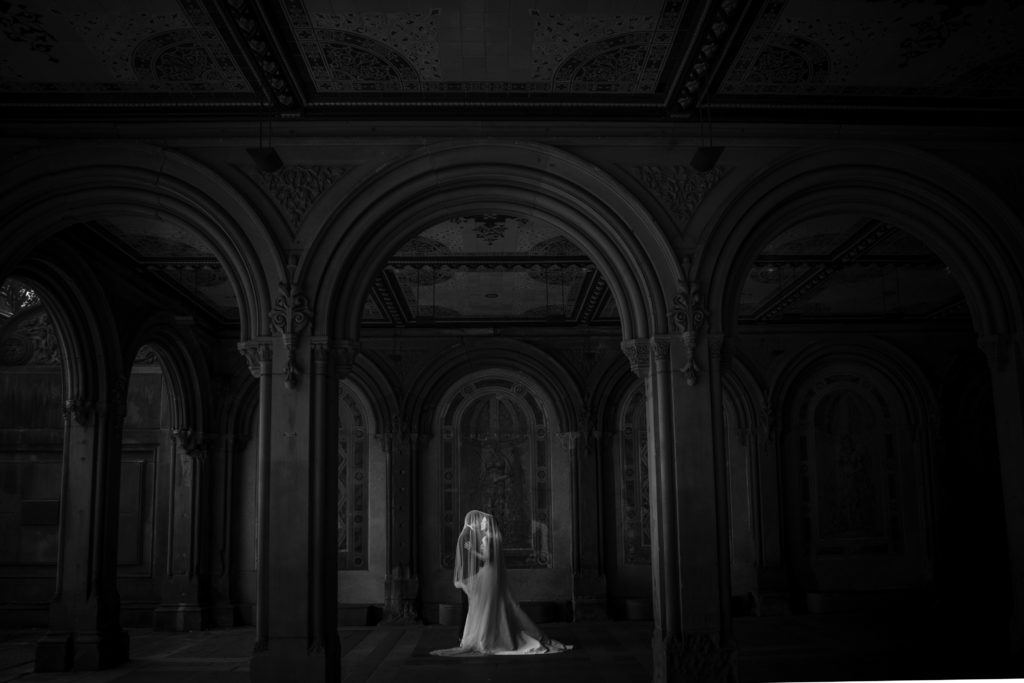 dark and moody couple's portrait under bethesda terrace in central park